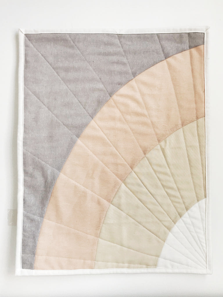 Rainbow Days Mini Quilt Hanging on wall