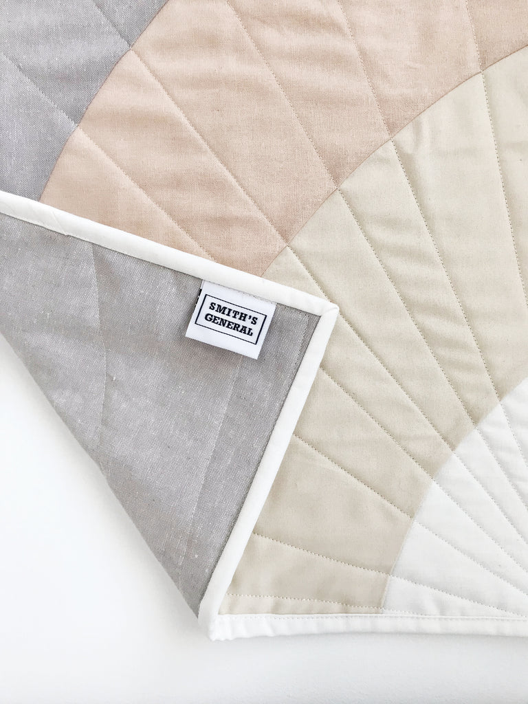 Back of Rainbow Days Mini Quilt tucked over